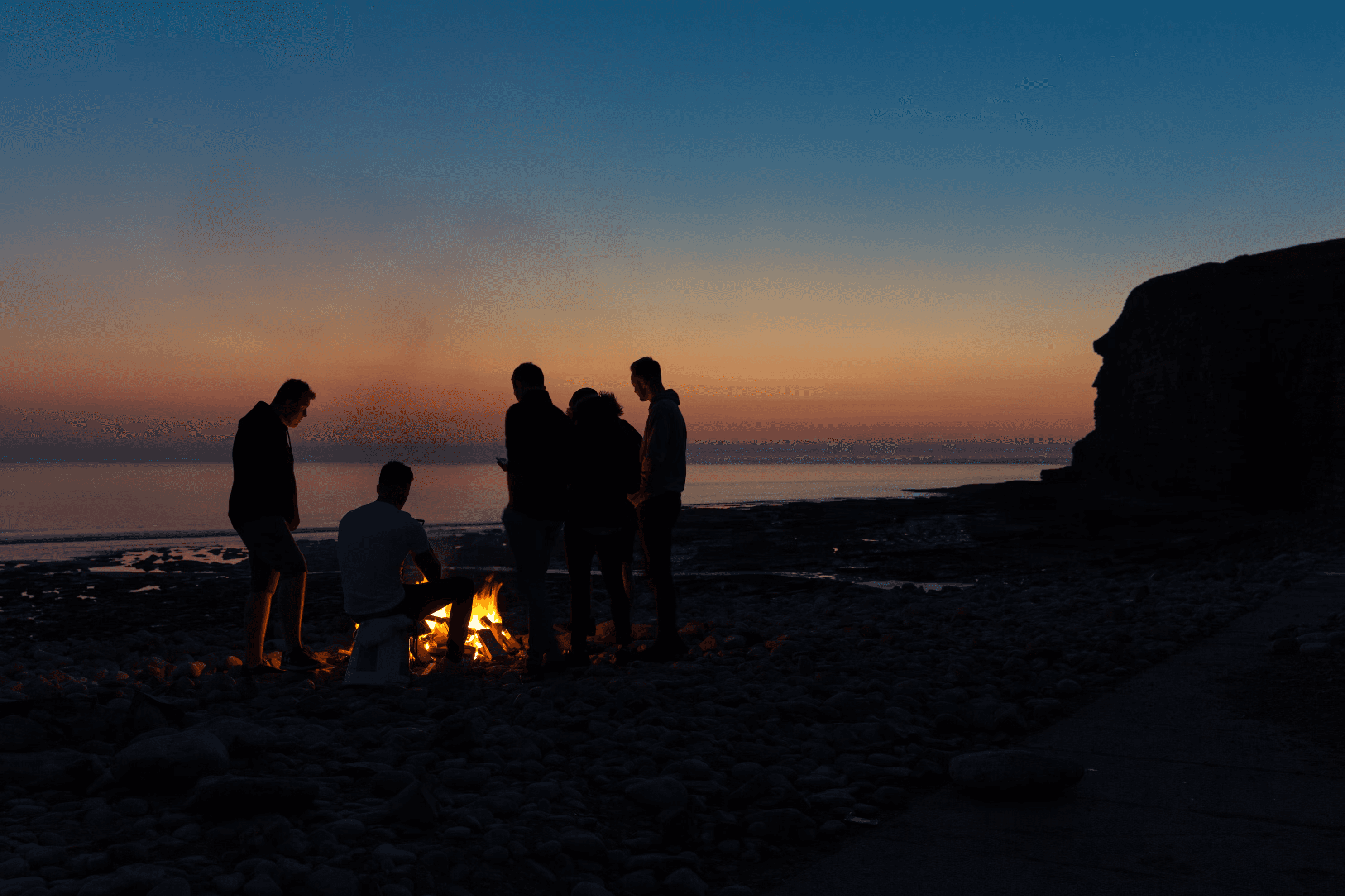 a beach bonfire in the evening